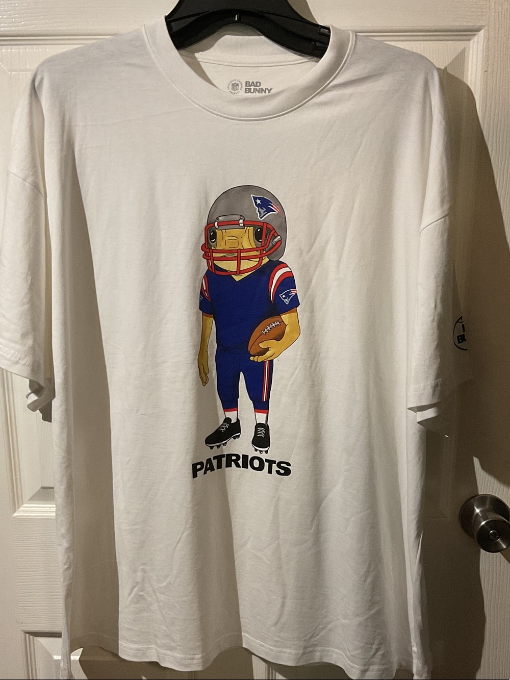 NFL/Bad Bunny Collaboration Patriots Tee with Backhit and Arm Hit